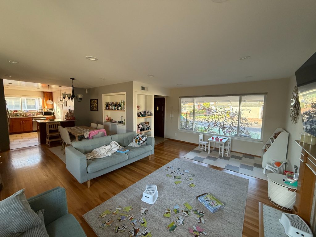 Before: living room looking towards kitchen and dining area